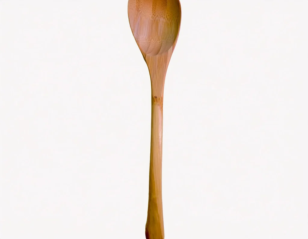 Jonathan's Spoons Spootle resting on a wooden surface, showcasing its unique flat edge and cherrywood finish.